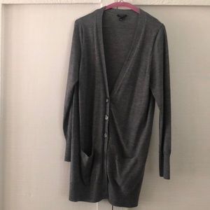 Grey long sleeve cardigan with front pockets.